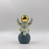 Cute Gold White Astronaut Statue, Spaceman Figurine Decor. | Cute astronaut figurine with victory gesture. Solid textured statue, artistic ornament for desk and shelf home decoration.