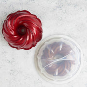 Holiday Formed Swirl Bundt with Cake Keeper | Red by Nordic Ware – 10 cup, BPA & Melanie free plastic, Red, Model 52025