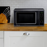 0.7 cu. ft. Countertop Microwave in Black - 700W (10.1"H x 17"W x 12.5"D) by Magic Chef – 0.7 cu. ft., 0.7 cubic_feet, Steel, Black, Model MC77MB