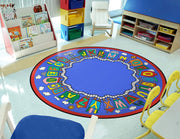 Kid Essentials Language & Literacy Reading Train Rug by Joy Carpets – 13'2" (Round), Nylon, Multicolored, Model 1429XLE-01