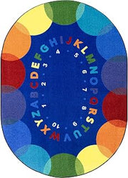 Joy Carpets Take A Seat 5'4" x 7'8" Oval Area Rug in Color Multi