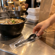 Choice Soup Spoon, 5 3/4" Long, Black, 250/Pack - in use