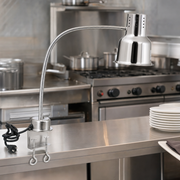 Avantco HL24SSC 24" Single Arm Stainless Steel Heat Lamp with Avantco PCLMPSS Stainless Steel Clamp - 120V, 250W - lifestyle