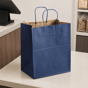 Navy Blue Paper Shopping Bag with Paper Handles, 10" x 6 3/4" x 12", 60 lb., 250/Case - lifestyle