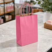 Paper Shopping Bag with Paper Handles, Pink, 5 1/2" x 3 1/4" x 8 3/8", 60 lb., 250/Case - lifestyle