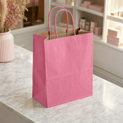 Paper Shopping Bag with Paper Handles, Pink, 8" x 4 1/2" x 10 1/4", 60 lb., 250/Case - lifestyle