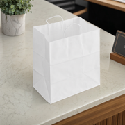 White Paper Shopping Bag with Paper Handles - 14" x 10" x 15 3/4", 70 lb., 200/Case - lifestyle