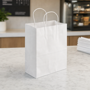 White Paper Shopping Bag with Paper Handles, 8" x 4 1/2" x 10 1/4", 60 lb., 250/Case - lifestyle