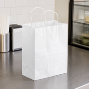 White Paper Shopping Bag with Paper Handles, 8" x 4 1/2" x 10 1/4", 60 lb., 250/Case - lifestyle