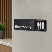 Lavex Black and White Unisex Restrooms Sign 9" x 3" - lifestyle
